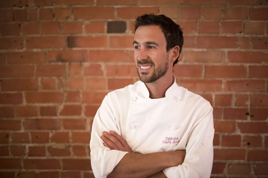 Chef Dakota Soifer welcomes guests to Cafe Aion for a culinary tour of Trump's seven banned countries. - ALY NICKLAS