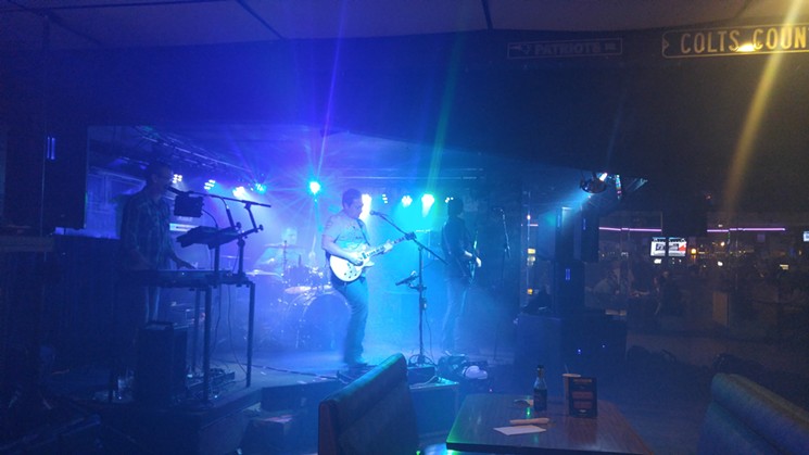 Cover band Live to Tell hits the stage at Sweetwater Bar and Grill, complete with a fog machine. - SARAH MCGILL
