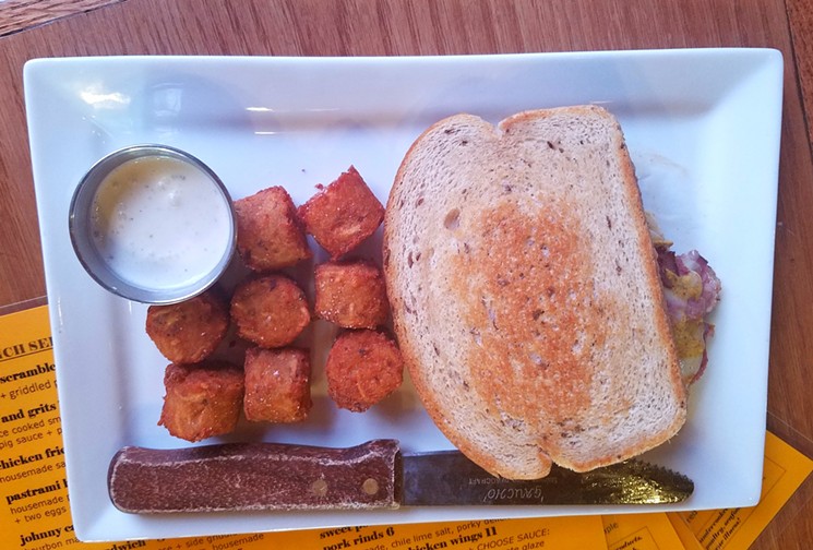 Highland Tavern's reuben sandwich with a side of handcrafted tater tots. - LINNEA COVINGTON