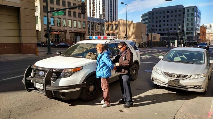 A disability-rights protester getting cuffed amid a January 27 protest. - PHOTO COURTESY OF JEFF HART