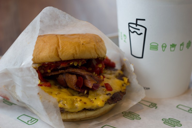 You'll soon be biting into a Shake Shack burger in RiNo. - FLICKR/VAGUEONTHEHOW