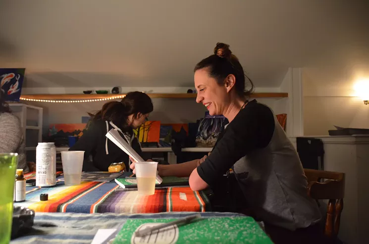 Heidi Keyes, founder of Puff, Pass and Paint, reads aloud from a Beautiful Corpse piece. - LINDSEY BARTLETT