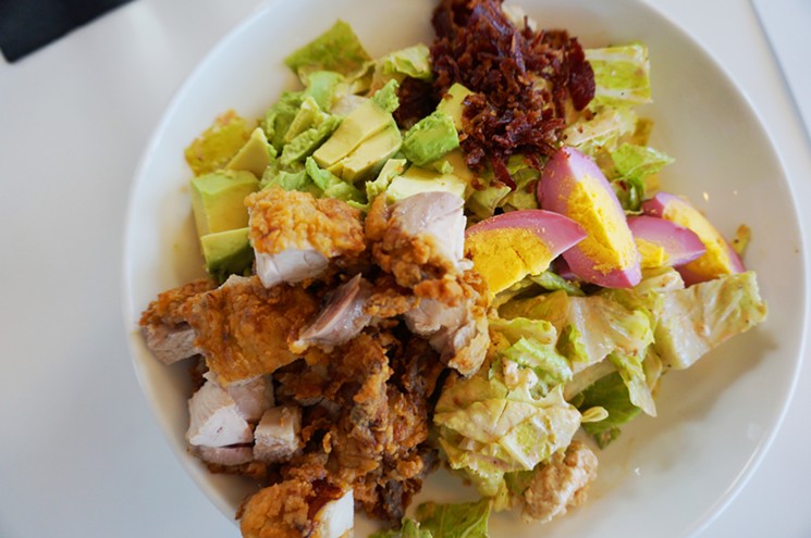Fried-chicken Cobb salad with pickled eggs and crisped pastrami. - MARK ANTONATION