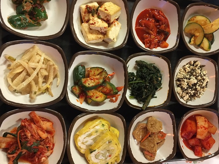 A generous array of banchan at Shin Myung Gwan. - LAURA SHUNK