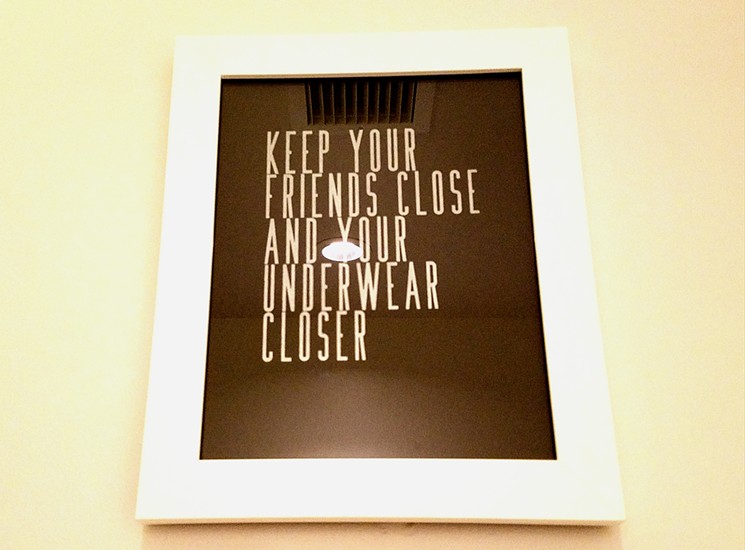 Cheeky prints by Courtney Leapley hang in the bathrooms. - LINNEA COVINGTON