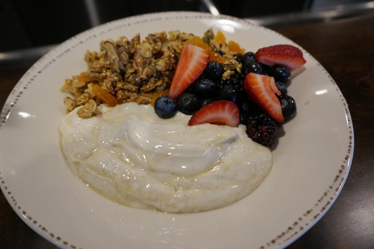 Noosa yogurt with housemade granola and berries. - MARK ANTONATION