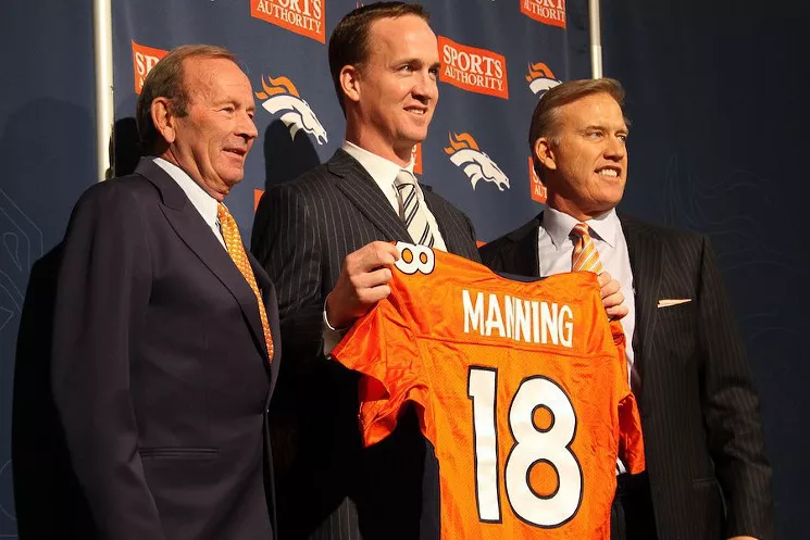 Peyton Manning, with Broncos owner Pat Bowlen and executive John Elway, during the press conference announcing his signing with the Broncos in 2012. - PHOTO BY BRANDON MARSHALL