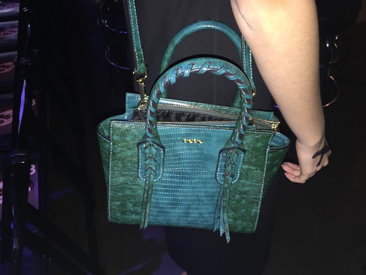 This turquoise python purse is from Bebe, one of Ramer's favorite stores. - PHOTO BY MAURICIO ROCHA