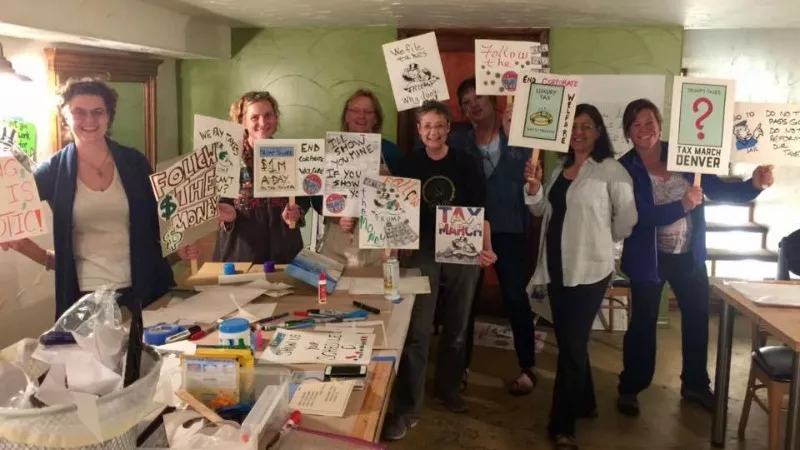 Demonstrators from the Indivisible Denver CD1 group getting ready for the recent Tax March. - FACEBOOK