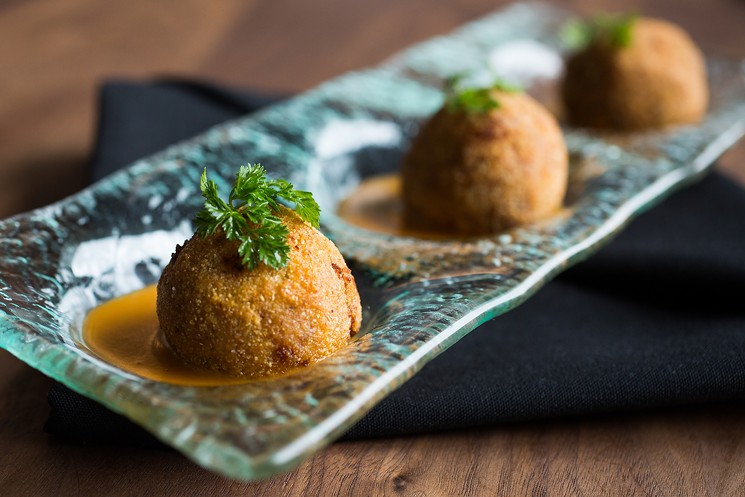 These octopus-and-bacon risotto balls could be chef Lon Symensma's next big hit. - DANIELLE LIRETTE