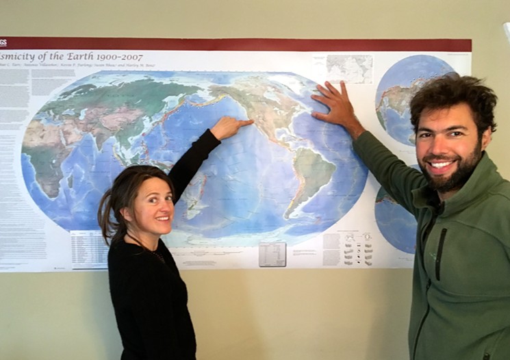 Egnell and Fluxa posing next to a world map in my house. - CHRIS WALKER