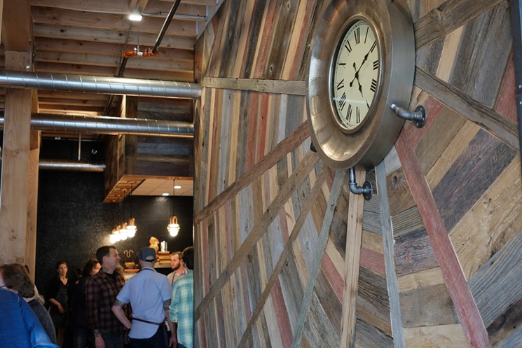 This art-clock feature is made from reclaimed wood. - SARAH COWELL