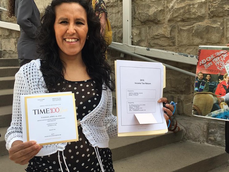 Jeanette Vizguerra holds up a copy of her certificate stating that she was named one of Time magazine's 100 most influential people in the world. - COURTESY OF THE MEYER LAW OFFICE