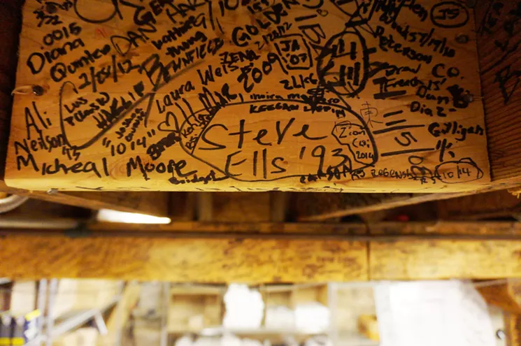 Chipotle founder Steve Ells signed his name on a basement beam in 1993, the year the company launched. - MARK ANTONATION