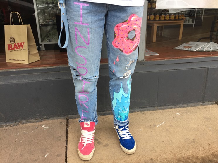 MayG hand-painted a pink doughnut and other designs on her jeans. - PHOTO BY MAURICIO ROCHA