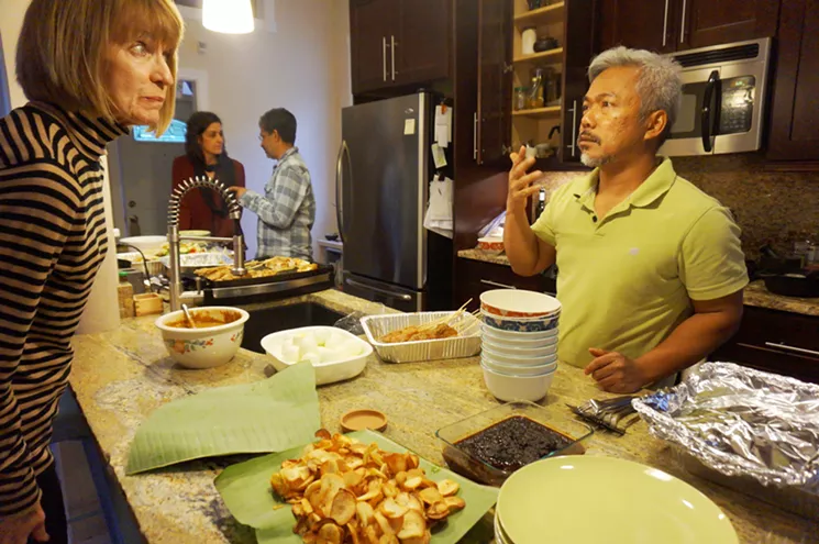 Communal Platter chef Musa Sapari talks about his Malaysian dishes with a guest at a recent dinner. - MARK ANTONATION