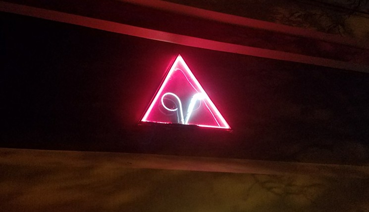 Videotique's original pink and white neon logo will soon flicker off. - KEITH GARCIA
