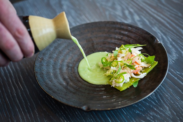 King crab with avocado, pickled shallot, serrano chiles, puffed rice and coconut-chile broth. - DANIELLE LIRETTE