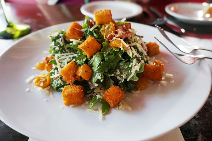 The house Caesar salad, topped with crispy polenta croutons. - MARK ANTONATION
