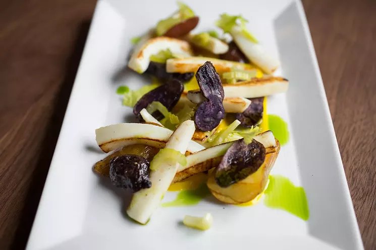 Humboldt calamari with lemon emulsion, potatoes and pickled celery hearts at Concourse. - DANIELLE LIRETTE