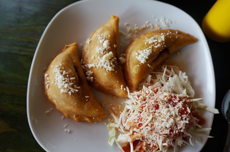 Crunchy pastelitos are similar to Mexican empanadas at Honduras Breeze. - MARK ANTONATION