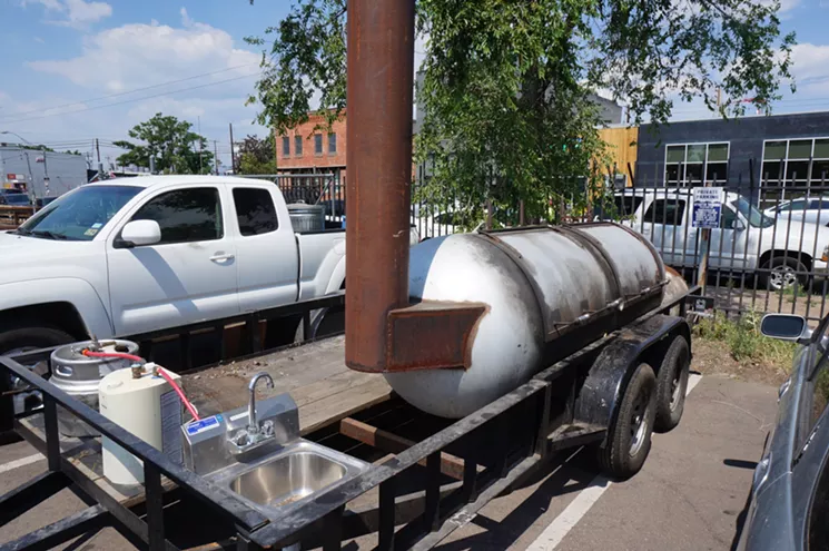 Owlbear's current offset smoker in its new home next door to Our Mutual Friend Brewery. - MARK ANTONATION