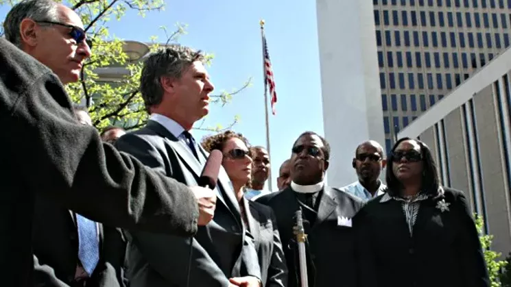 Reverend Spencer Booker and Gail Booker, right, at a 2011 press conference about the death of Marvin Booker. - PHOTO BY NICK LUCCHESI