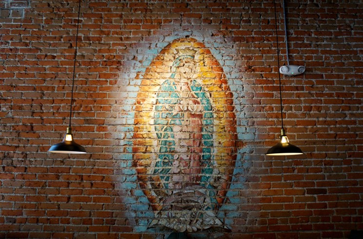 Some things — like this Madonna image on the wall at Las Delicias — are timeless. - LILA THULIN