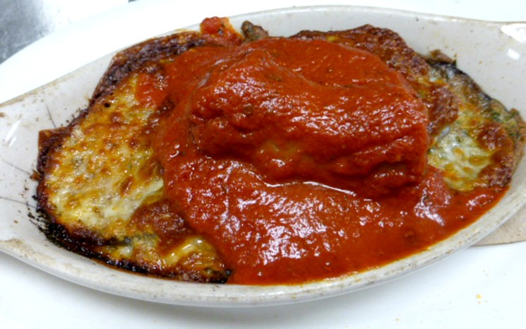 Romano's eggplant Parmesan sports a layer of the family's famous sauce. - KEN HOLLOWAY