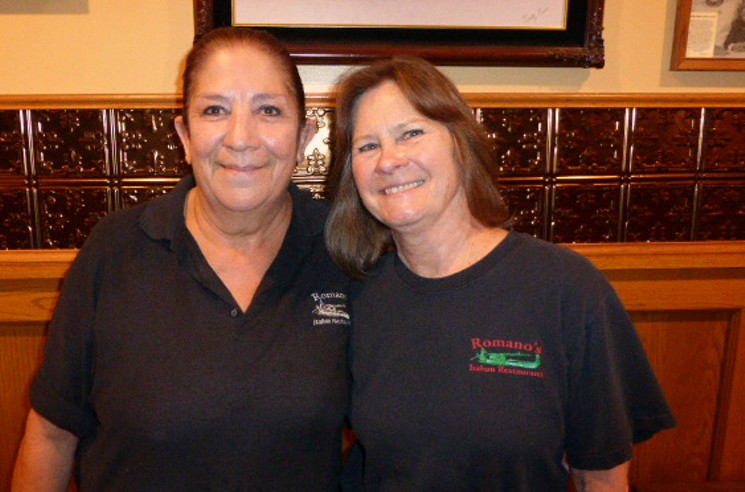 Gloria Villanueva (left) and Sharon Ducombs (right) have more than sixty years of working at Romano's between them. - KEN HOLLOWAY
