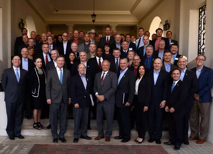 Colorado Springs Mayor John Suthers stands between Governor John Hickenlooper and NCC head Ed Rios (front, center) at the 2016 Governor's Cyber Symposium. - NATIONAL CYBERSECURITY CENTER