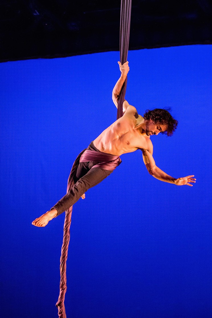 Teo Spencer of Pilobolus performs with aerial silks. - NINA REED PHOTOGRAPHY
