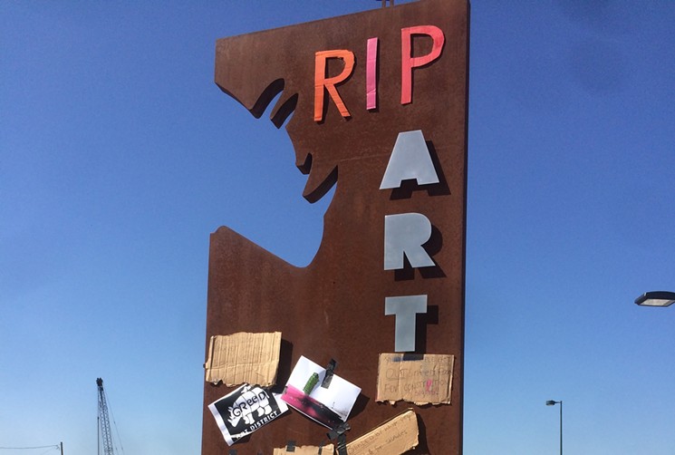 Artists are turning RiNo Arts District promotional sculptures into sites of mourning to lament the impact of gentrification on the neighborhood. - AMPLIFY ARTS DENVER