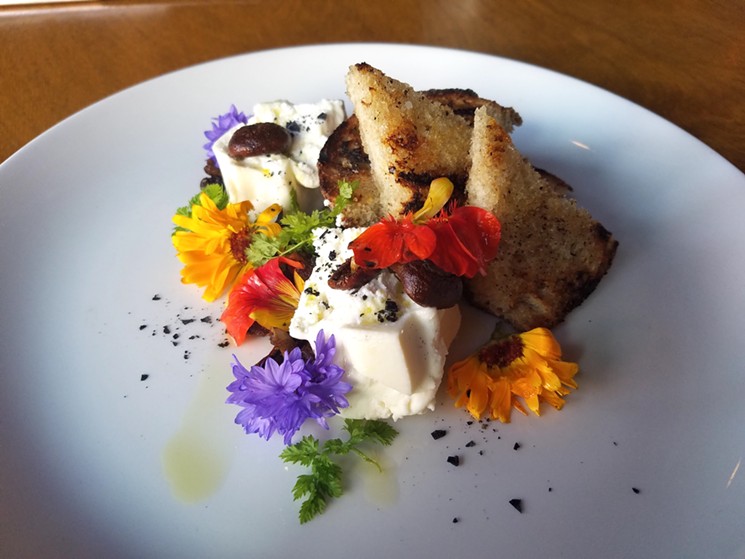 Housemade burrata with local mushrooms, edible flowers, sourdough by Grateful Bread, and truffle oil. - LINNEA COVINGTON