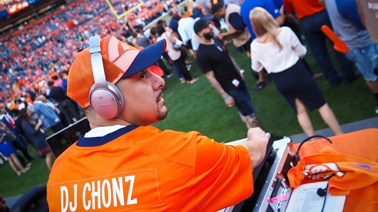 DJ Chonz spinning for the Denver Broncos. - COURTESY OF DJ CHONZ
