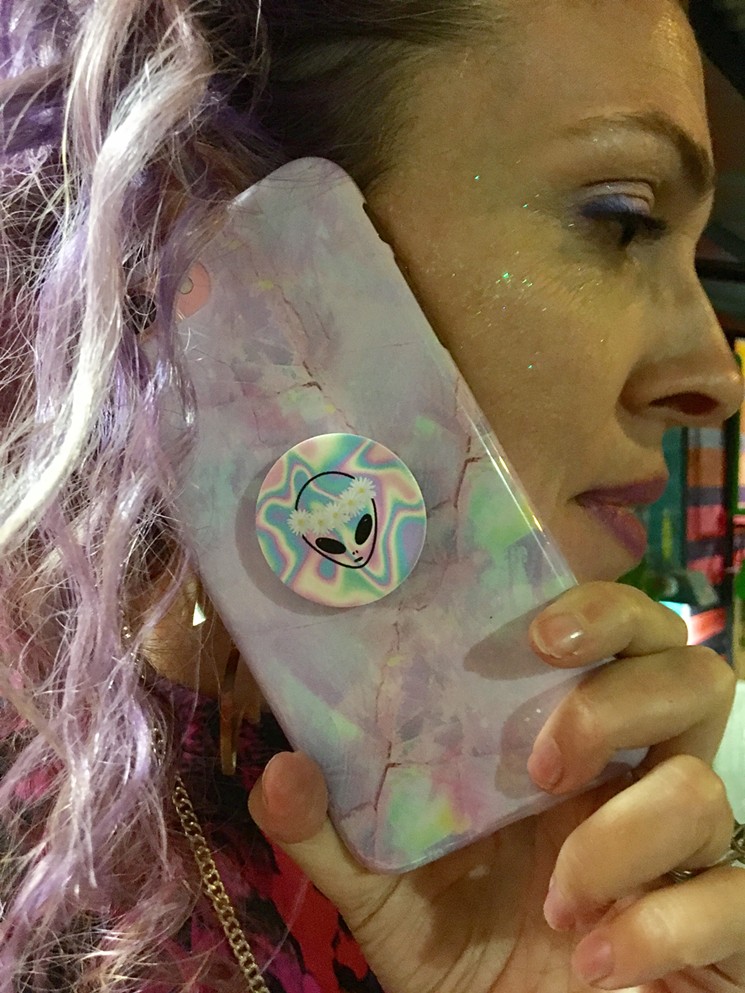 Even Reba Nelson's phone case is out of this world. - PHOTO BY AMANDA VAROZ
