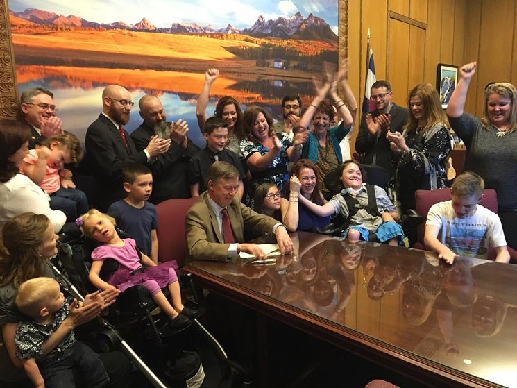 Governor John Hickenlooper signs House Bill 16-1373 , popularly known as Jack's Law, as Jack Splitt looked on. - PHOTO COURTESY OF STACEY LINN/CANNABILITY FOUNDATION