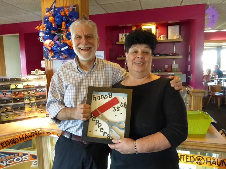 George Strompoulos and longtime employee Millie Miera celebrate her 35 years as a server at the restaurant. - KEN HOLLOWAY
