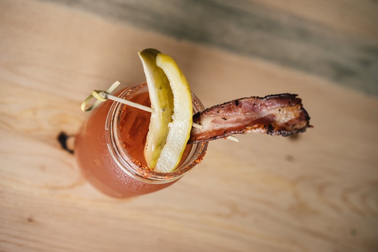 The Mary Mary, a take on the Bloody Mary with the Real Dill mixer, bacon and pickles. - SARAH ADDY PHOTOGRAPHY