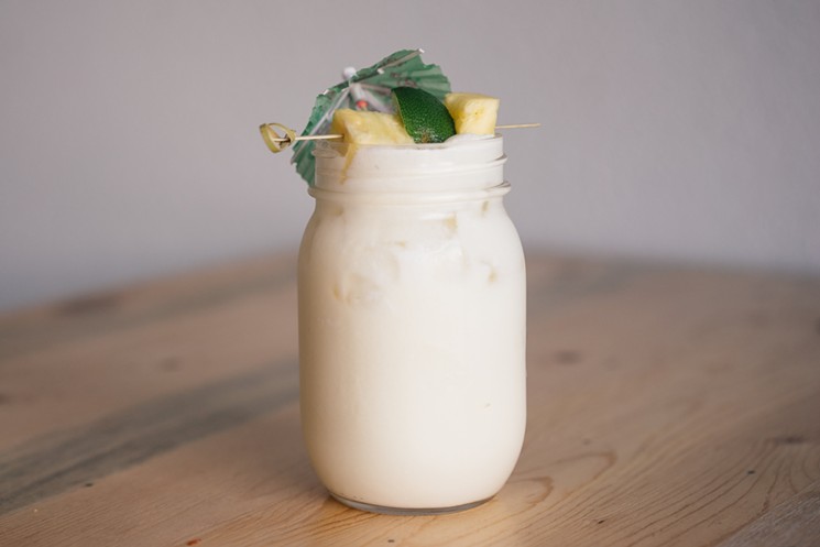 The coconut, vodka and pineapple laden Paleo Boat Drink at Just Be Kitchen. - SARAH ADDY PHOTOGRAPHY