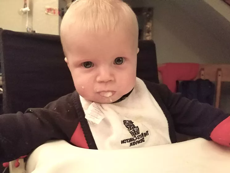 Though you might not be able to tell, this is one happy baby after he devoured a jar of Baby Fresh Organics parsnips. - LINNEA COVINGTON