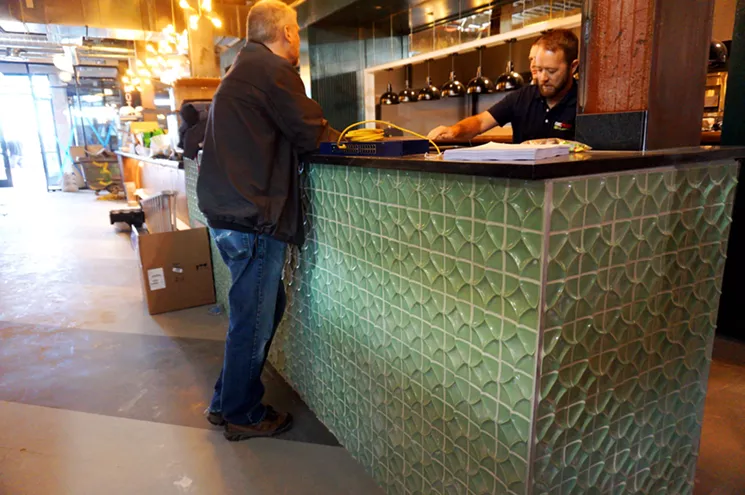 The first thing you see when entering Punch Bowl Social is the dining room and kitchen. - MARK ANTONATION