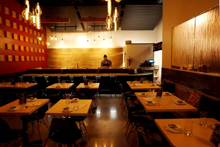 The main sushi bar and dining room at Izakaya Ronin. - MARK ANTONATION