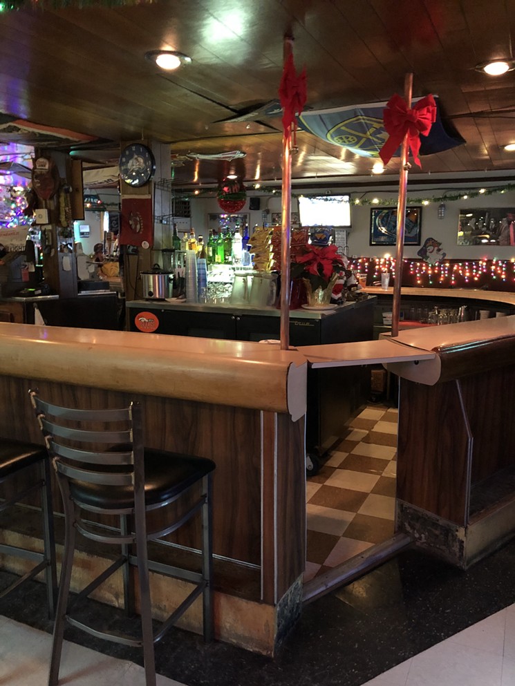 The bar looks festive, and old-school, at Sam's. - SARAH JAMES