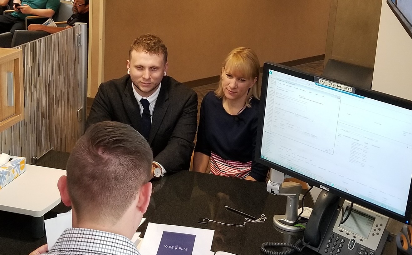 Taylor Rosean and Megan Lumpkins submit their application for a Cannabis Consumption Establishment license on June 7.
