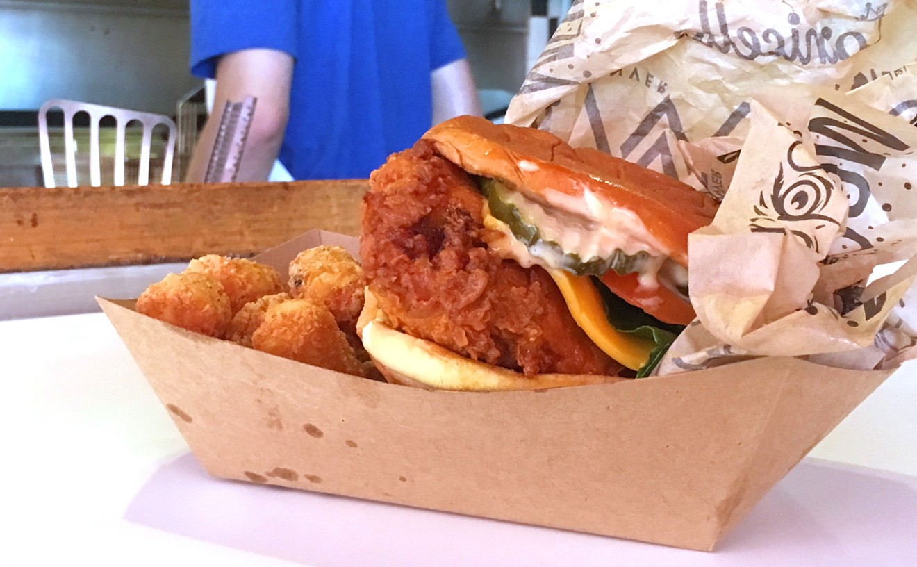 The Lou's Plus hot chicken sandwich with tots.