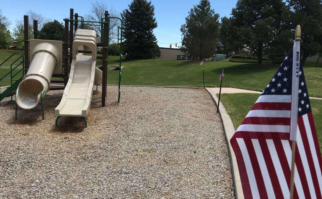 An unknown person removed the yellow caution tape from a Jefferson County playground and put up American flags in its place.