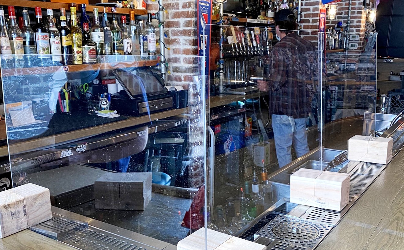Occidental added plexiglass barriers atop its bar.