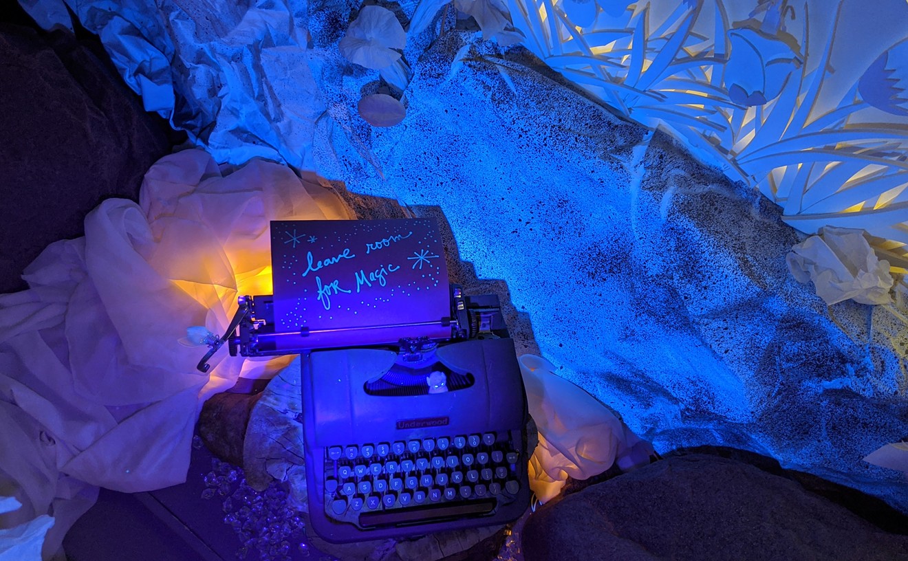 A scene from inside Shiki Dreams that is illuminated with a black light flashlight.