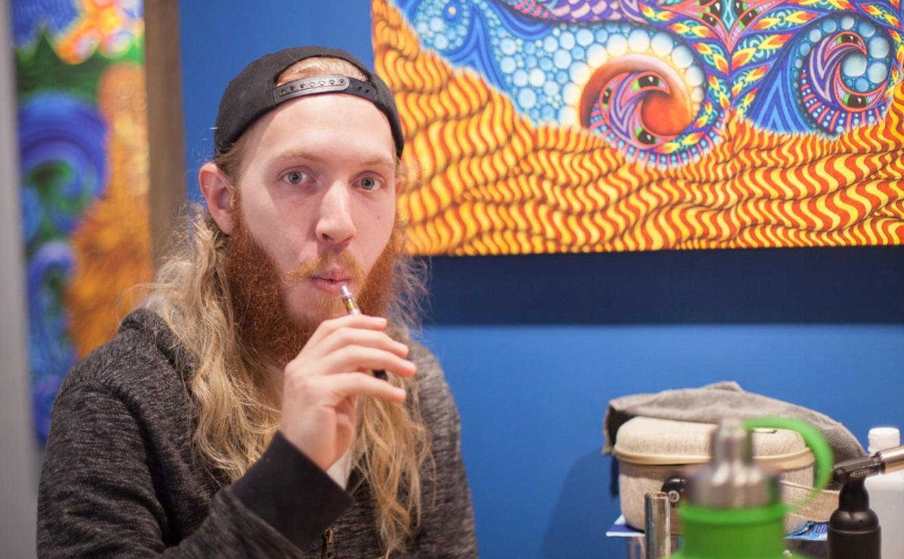 A private marijuana-friendly event takes place at Phil Lewis Art Studio & Gallery in Boulder.